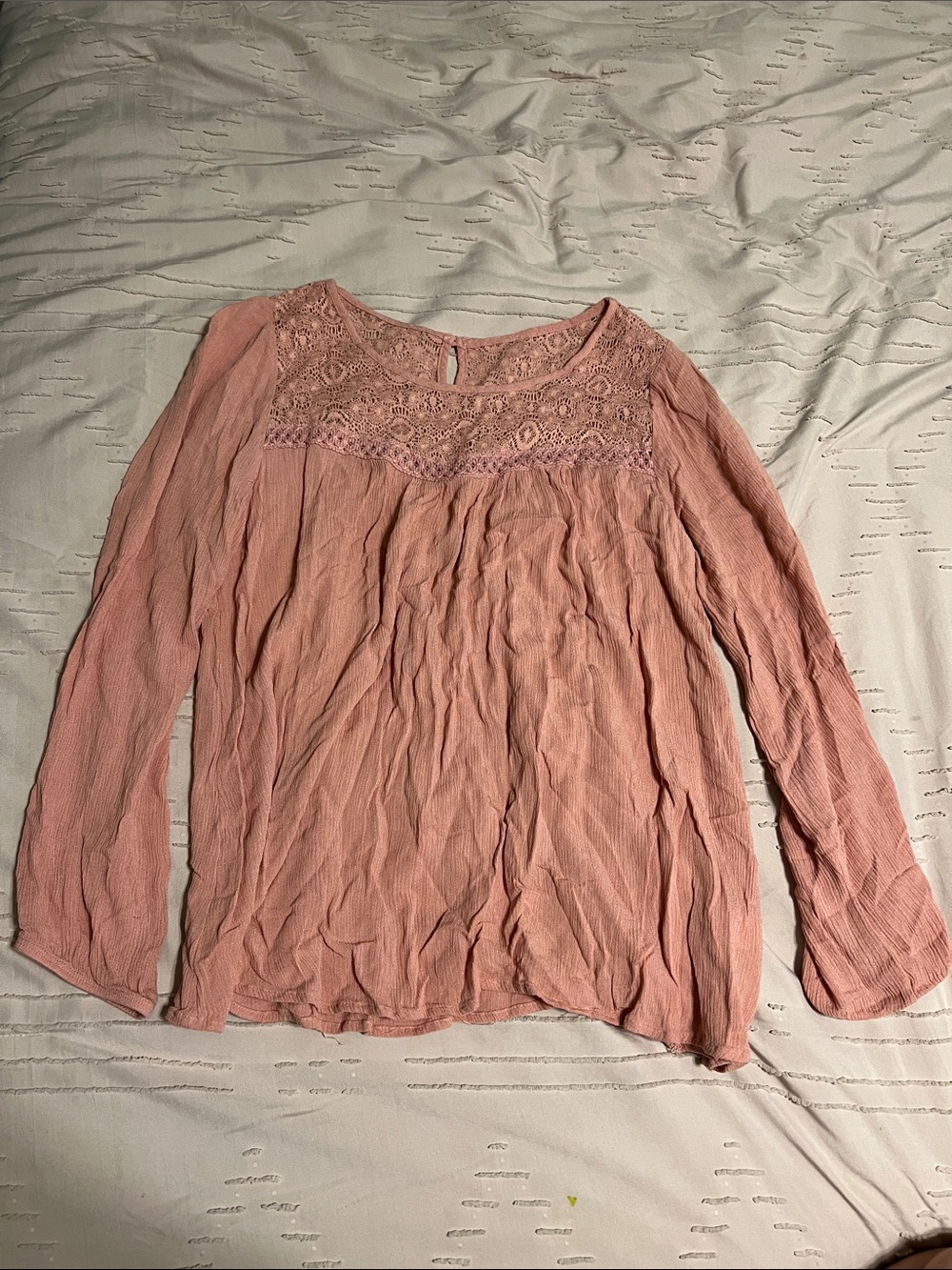 Pink blouse with lace shoulder area